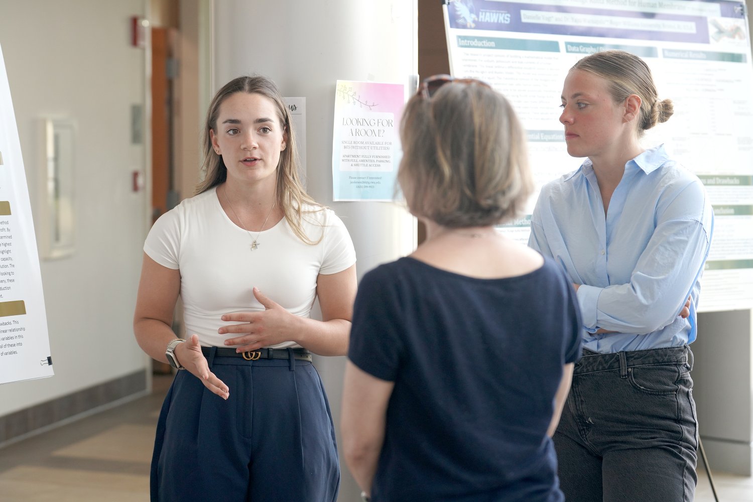 Juniors Gabrielle Petroniro and Danielle Vogt present their work.