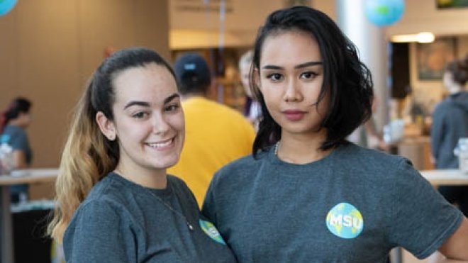 Two students pose.