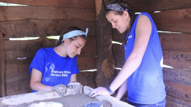 Students build a cookstove.