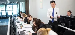 professor teaching to students on laptop