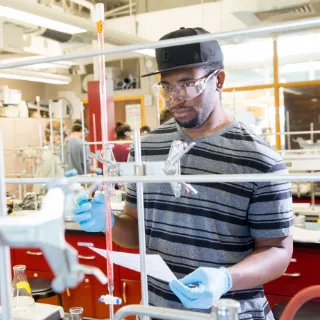 Student researching in lab at RWU