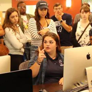 Image of Emily with students