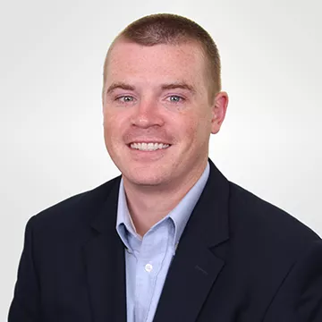 A headshot of Jospeh Mckenna