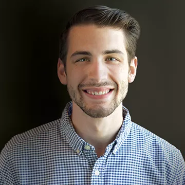 A headshot of Nick Corey
