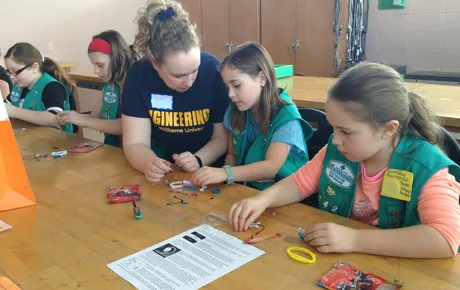 Students mentor Girl Scouts.