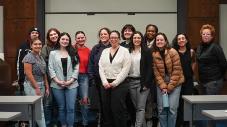 Panelist smile with attending students