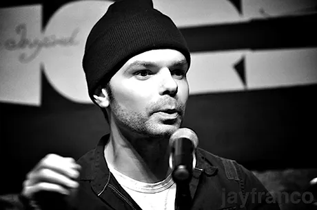 Poet performing on stage.