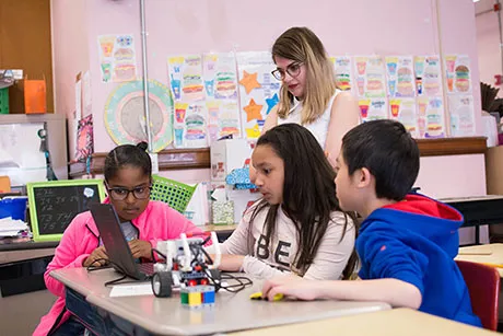 RWU student teaches engineering lesson to fourth graders.