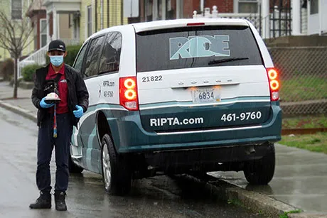 RIPTA driver delivers a meal to a homebound senior.