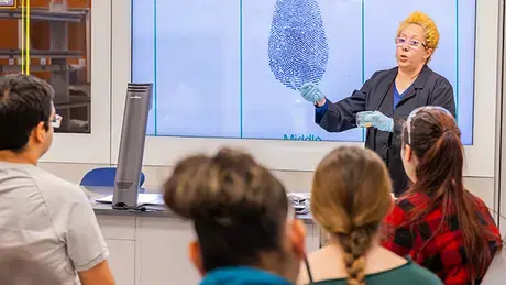 Students sit in RWU's forensics lab.