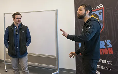 Poet works with student.