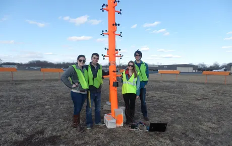 Students place their invention in the field
