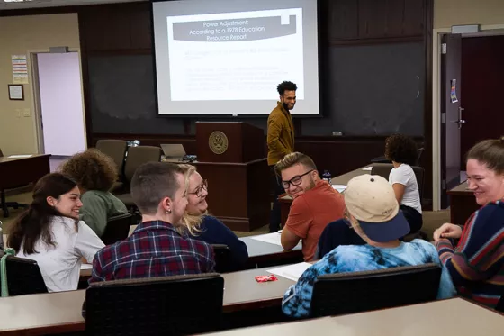 Student and professor in classroom.