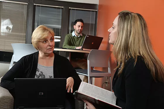 Student speaking with another student