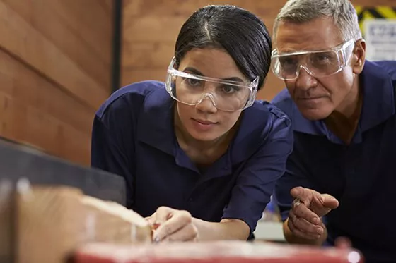 Two people working on a carpentry project