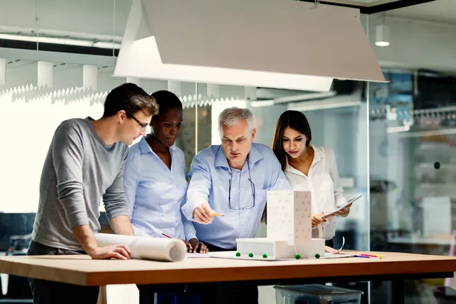 Architects look over real estate plans