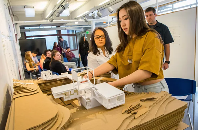 image of an RWU Architecture student presenting a project