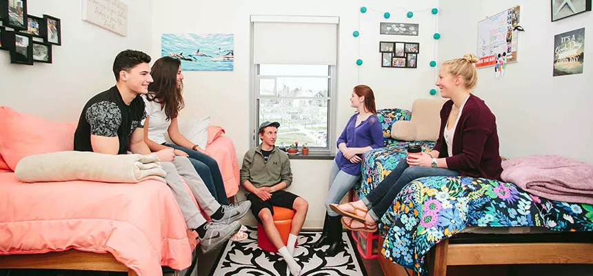 A group of students in a North Campus room.