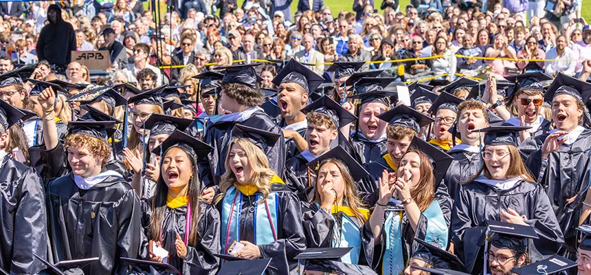 A group of excited graduates at commencement