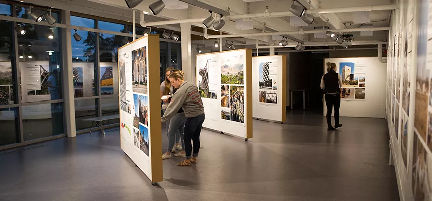Students take in an exhibit in the Architecture Gallery