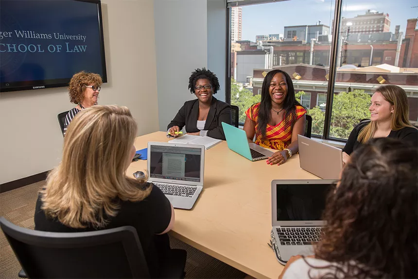 Students meeting in a room at Providence Campus.