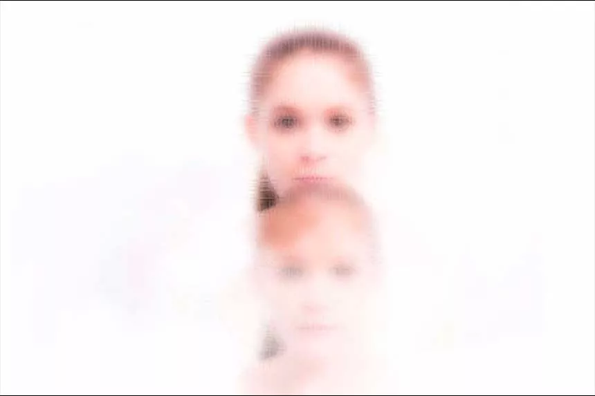The heads of two girls on top of one another.