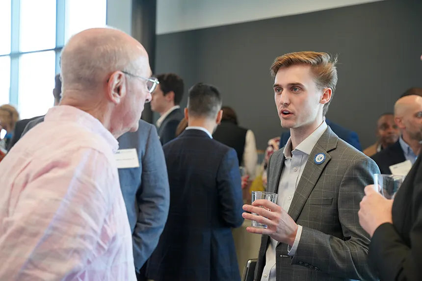 Real Estate Symposium attendees engage in deep discussions.