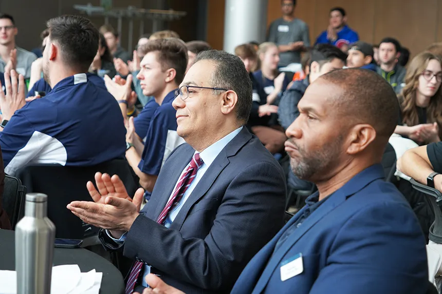 NECCDC attendees applaude.