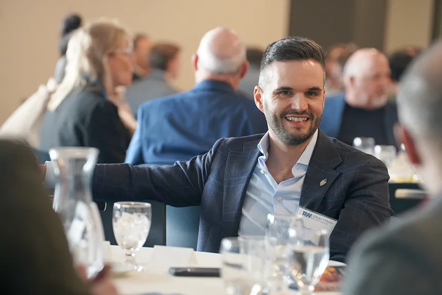 Real Estate Symposium attendees engage in deep discussions.