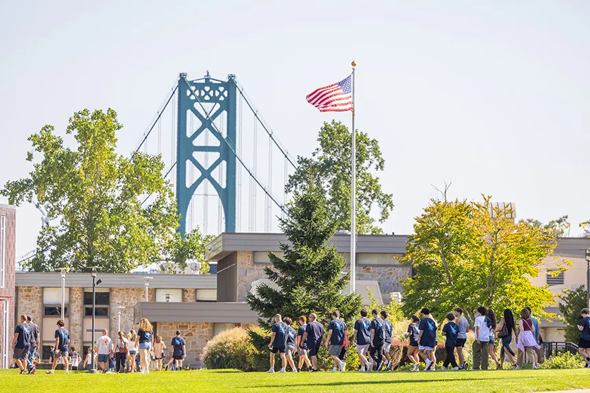 The Class of 2028 processes through campus.