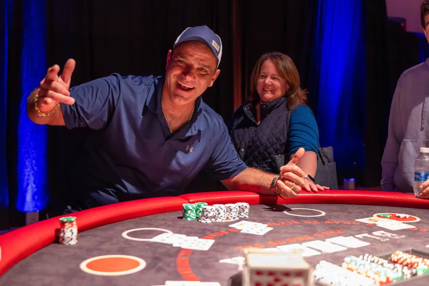 At Casino Night, a man gives thumbs up to the camera.