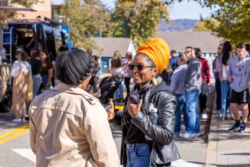 Attendees engage in a friendly dialogue.
