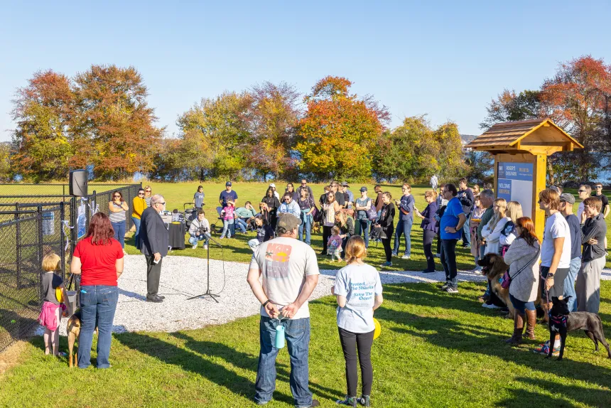 President Yannis speaks to a large crowd at the Roger's Dog Park ribbon cutting ceremony.