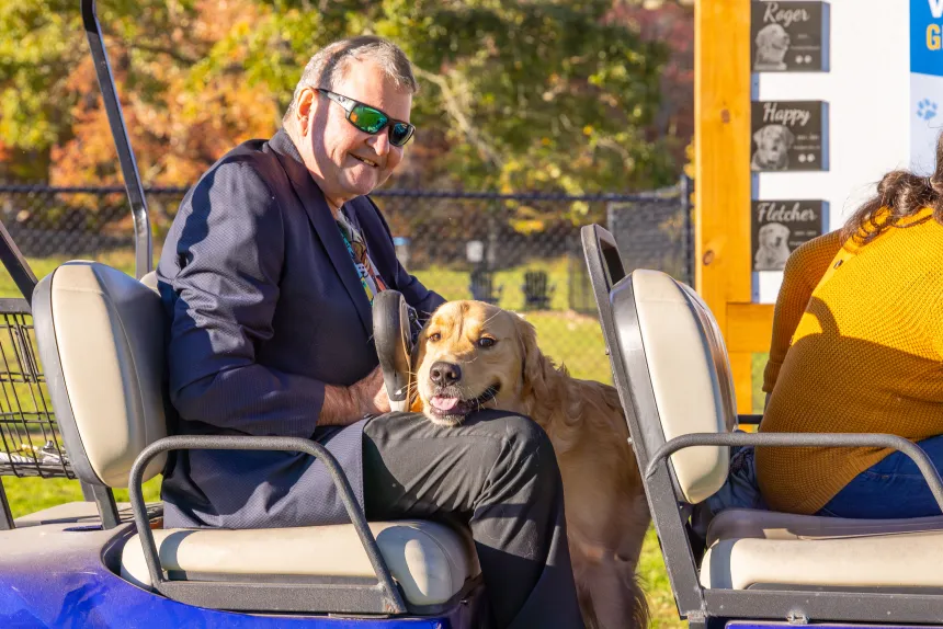 President Yannis poses with First Dog Roger.