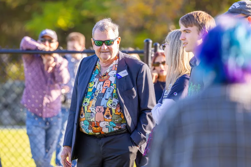 President Yannis looks on as canines and companions enjoy Roger's Dog Park.