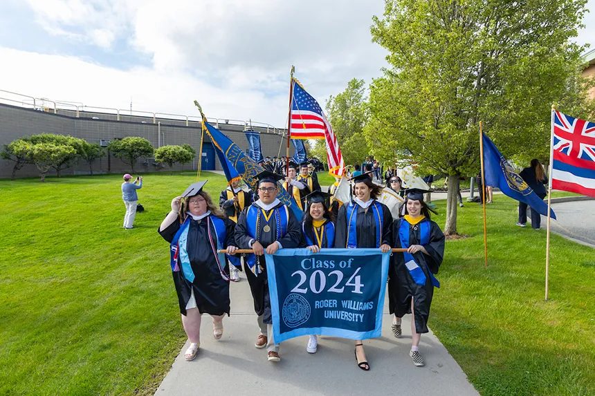 Class officers process with Class of 2024 banner