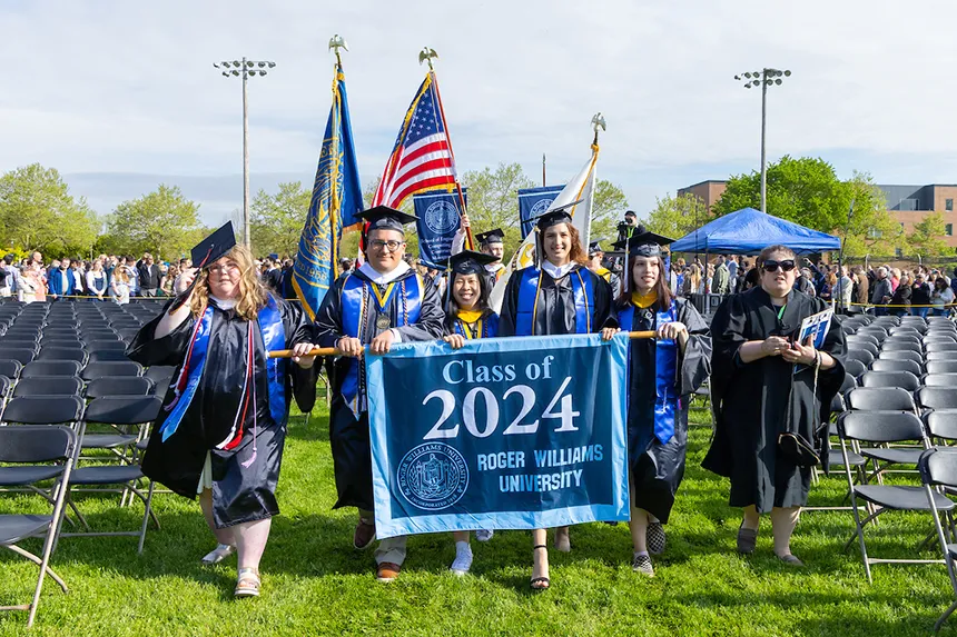 Class officers process with Class of 2024 banner