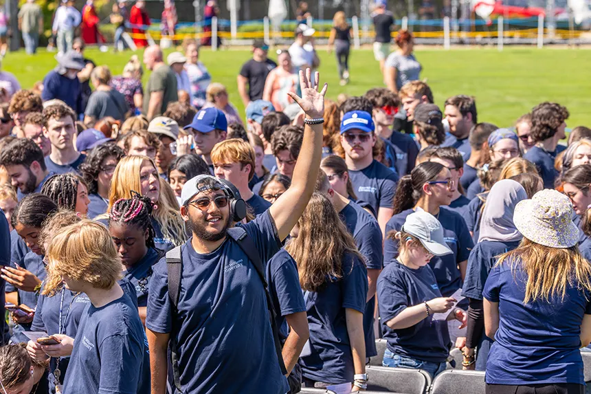 Members of the incoming class arrive at the athletic field for the Convocation ceremony.