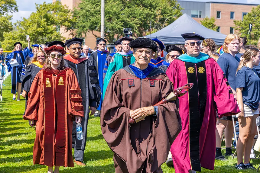 Faculty and Cabinet members make their way to the stage.