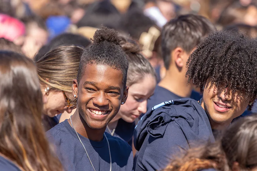 Students speak to each other during the Convocation ceremony.