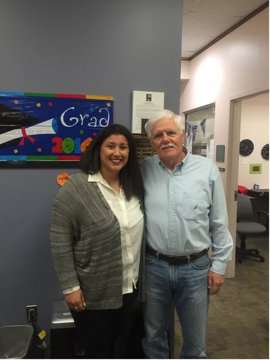 From left: 2016 Henderson Outstanding Tutor in Math, Kristina Biyad. She is congratulated by Richard Fullerton, Coordinator of the Math Center. 