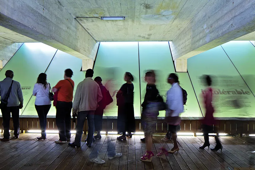 Visitors engage with the Memorial to the Abolition of Slavery in Nantes.