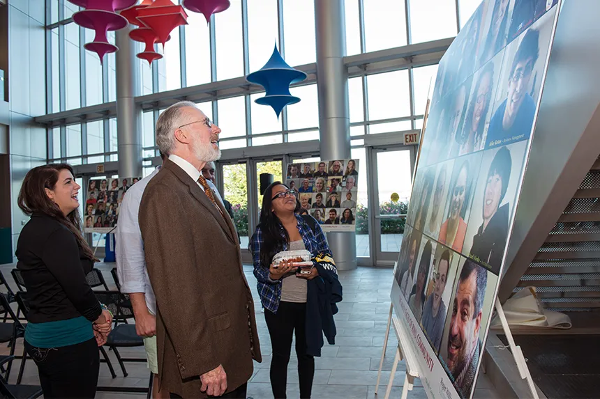 President Farish looks at student work.