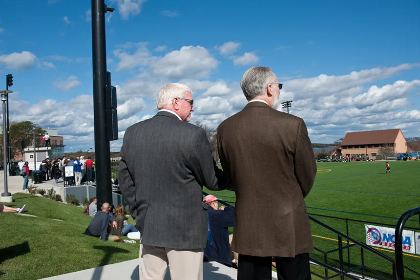President Farish watches a soccer game.