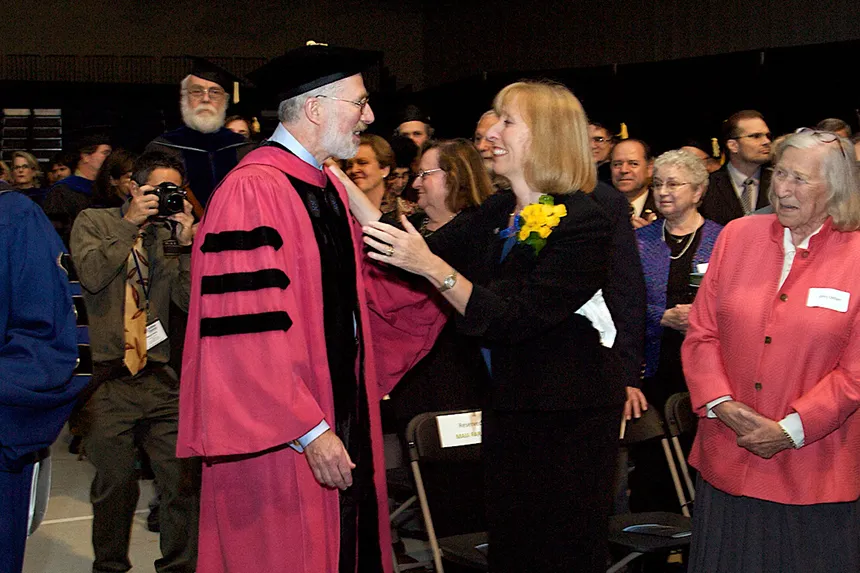 President and Maia Farish embrace during his inauguration as RWU's 10th President in 2011.