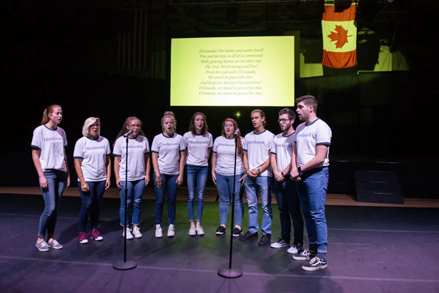 Students perform a song.