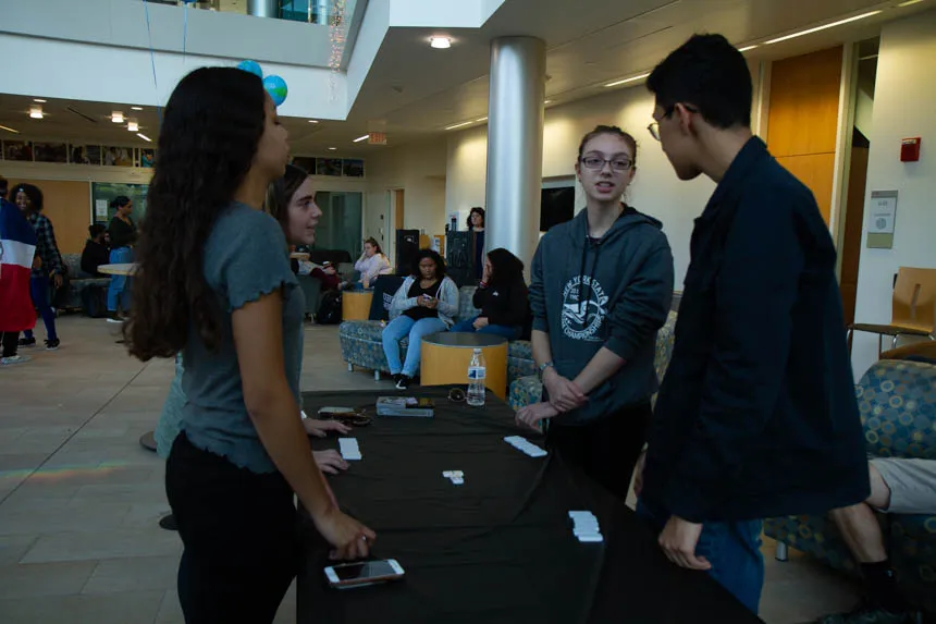 Students playing dominoes.