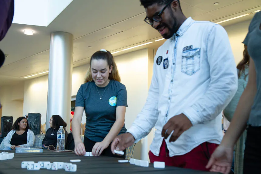Two students playing dominoes.