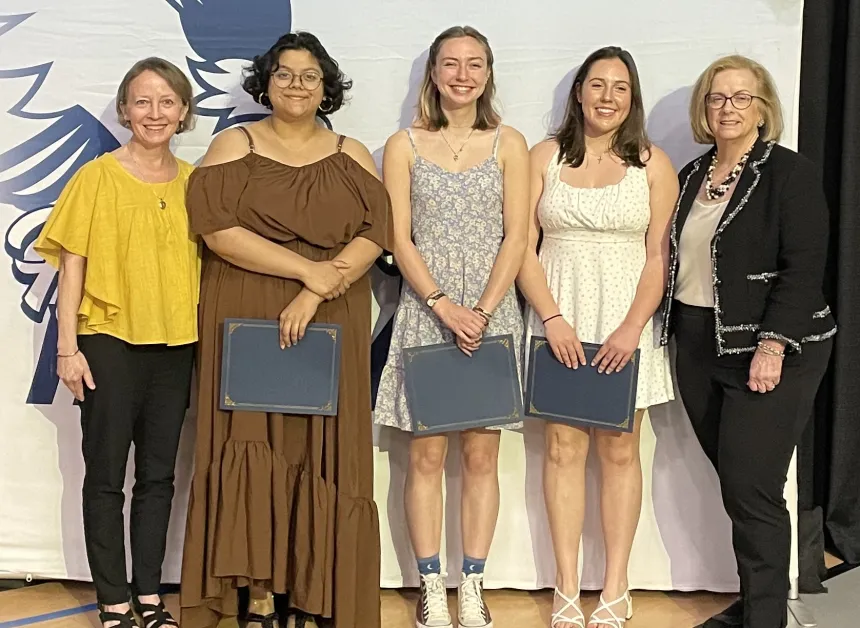 Henderson Outstanding Tutors for 2025 pose inside holding certificates