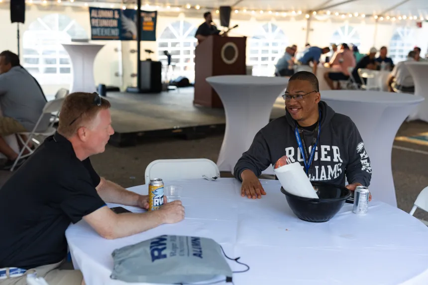 Alumni are welcomed back on campus as they listen to music.